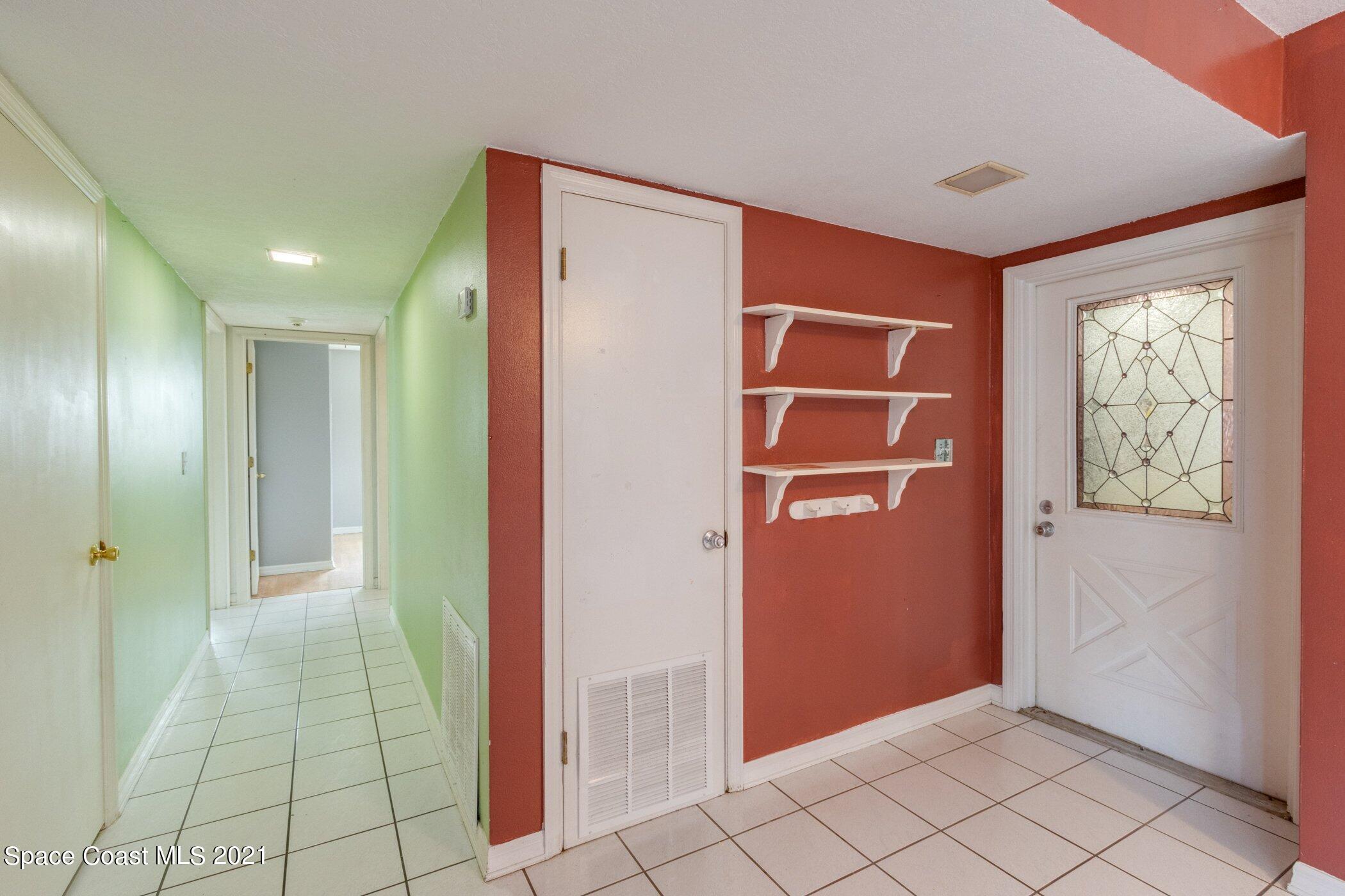 931 Bali Road Cocoa Beach, FL 32931 - Photo 20 of 42 Garage entrance/ Bonus room 2