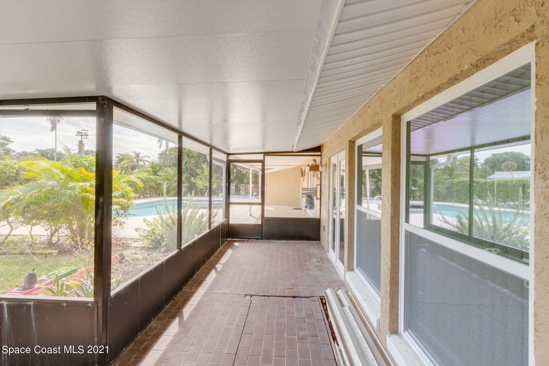 931 Bali Road Cocoa Beach, FL 32931 - Photo 27 of 42 Screen porch south