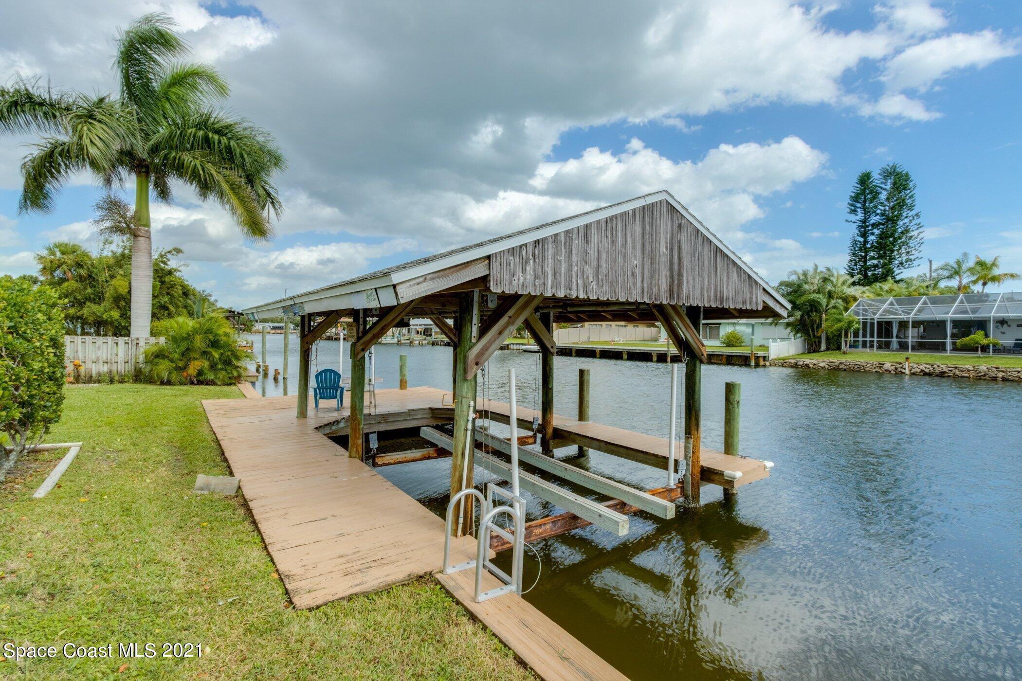 931 Bali Road Cocoa Beach, FL 32931 - Photo 29 of 42 Covered boat lift