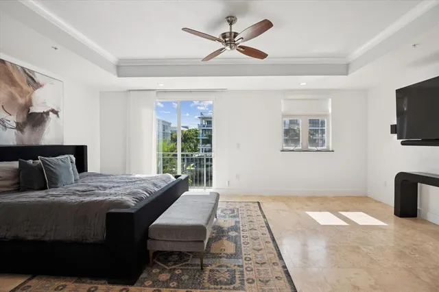 a bedroom with a bed and a tv