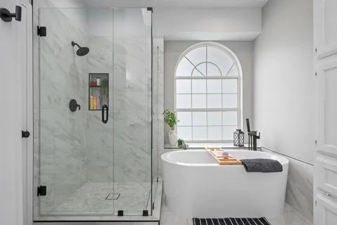 a bathroom with a sink a mirror and a bathtub