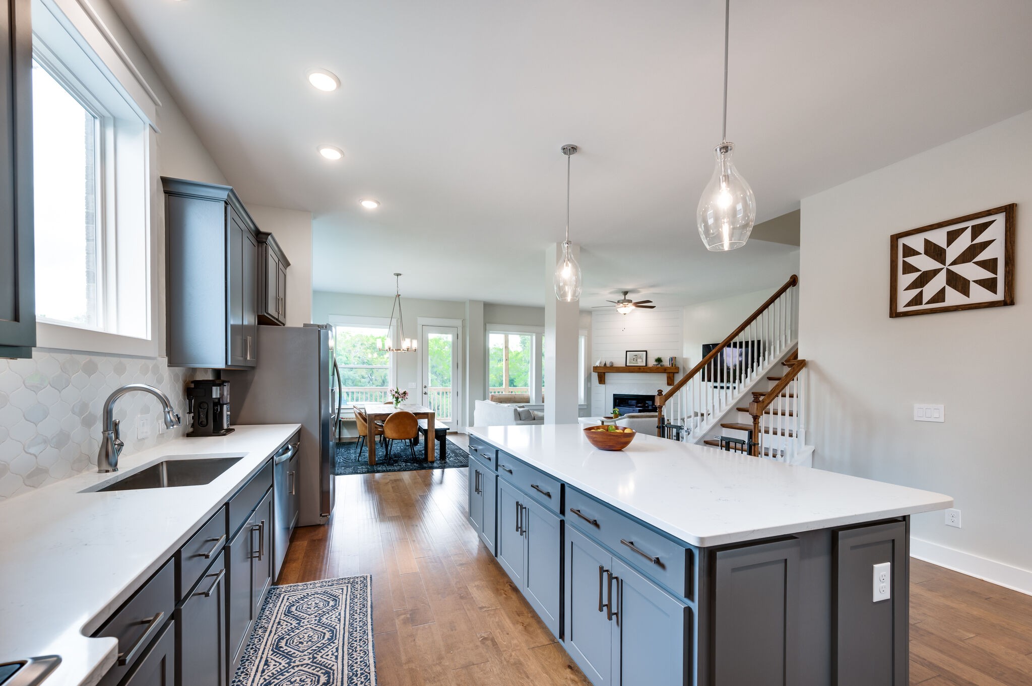 7751 Thayer Road Nolensville, TN 37135 - Photo 14 of 69 a kitchen with counter top space wooden floor and stainless steel appliances