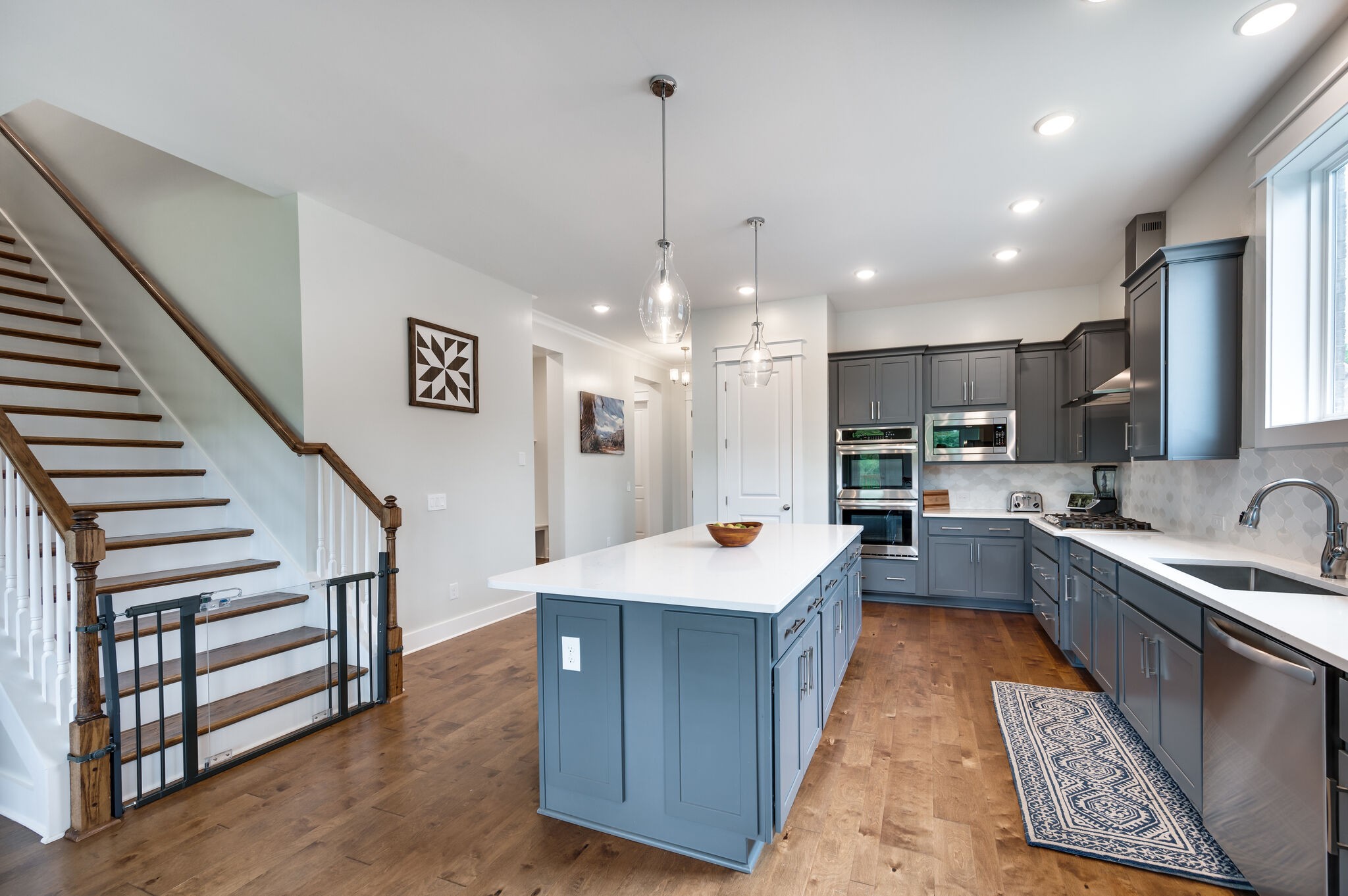7751 Thayer Road Nolensville, TN 37135 - Photo 15 of 69 a large kitchen with sink a refrigerator and chairs