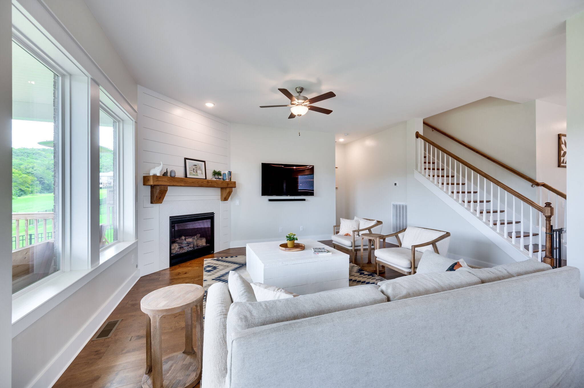 7751 Thayer Road Nolensville, TN 37135 - Photo 20 of 69 a living room with furniture a fireplace and a flat screen tv
