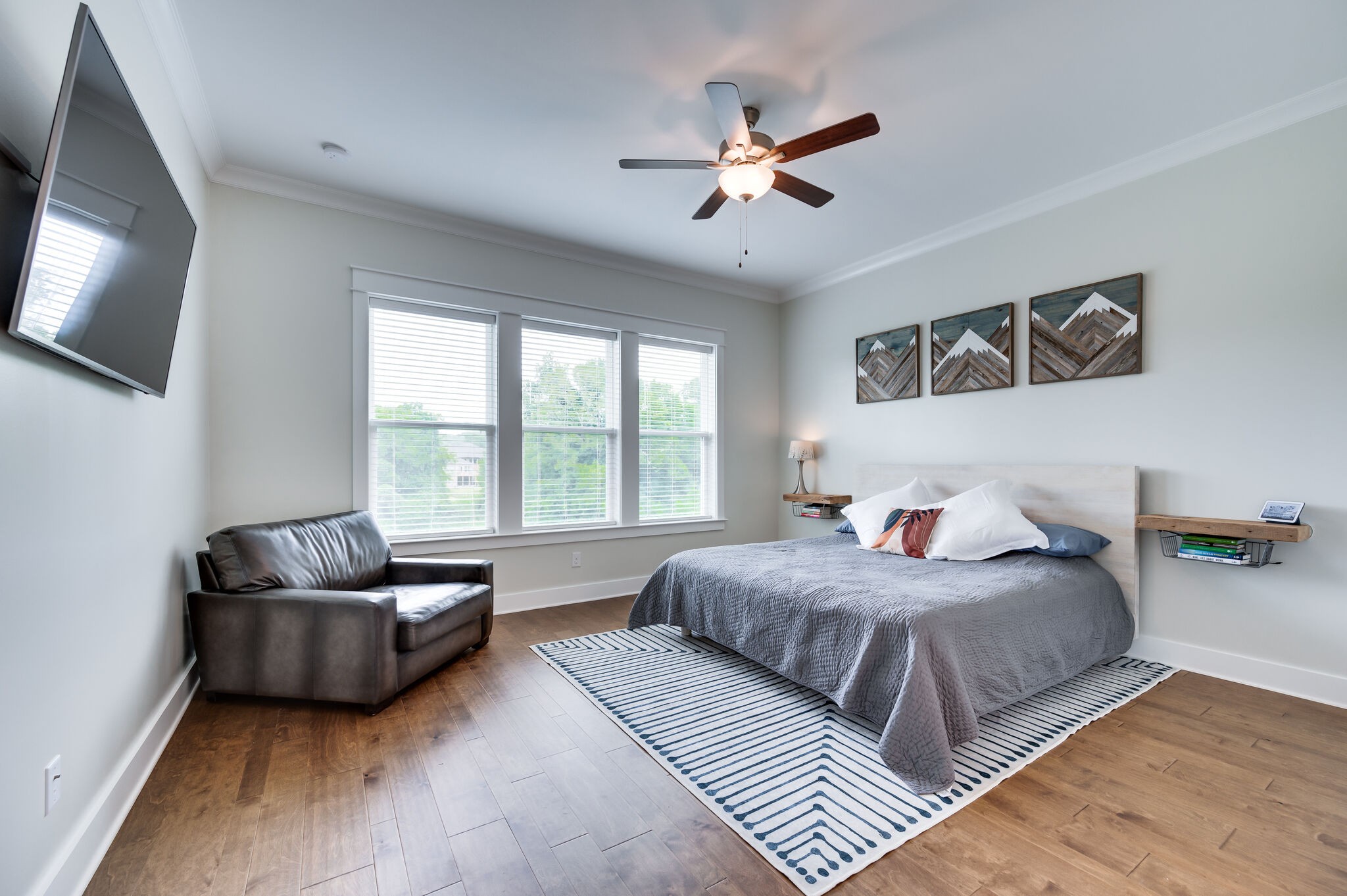 7751 Thayer Road Nolensville, TN 37135 - Photo 29 of 69 a bedroom with a bed a couch and a flat screen tv