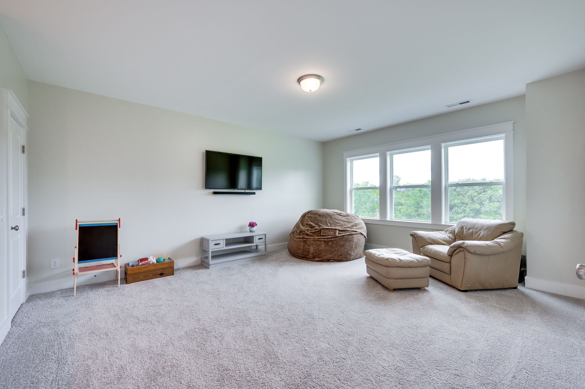 7751 Thayer Road Nolensville, TN 37135 - Photo 35 of 69 a living room with furniture and a flat screen tv