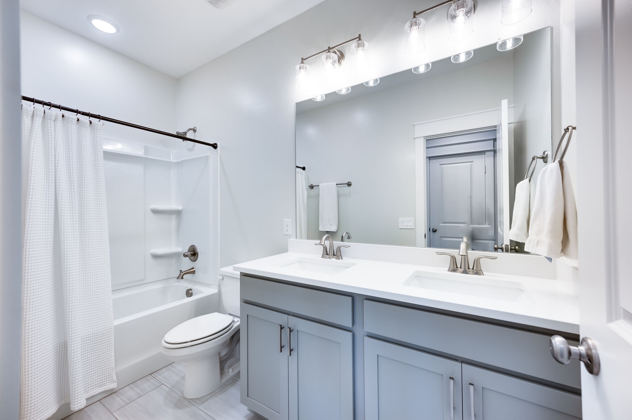 7751 Thayer Road Nolensville, TN 37135 - Photo 39 of 69 a bathroom with a sink a toilet and a large mirror