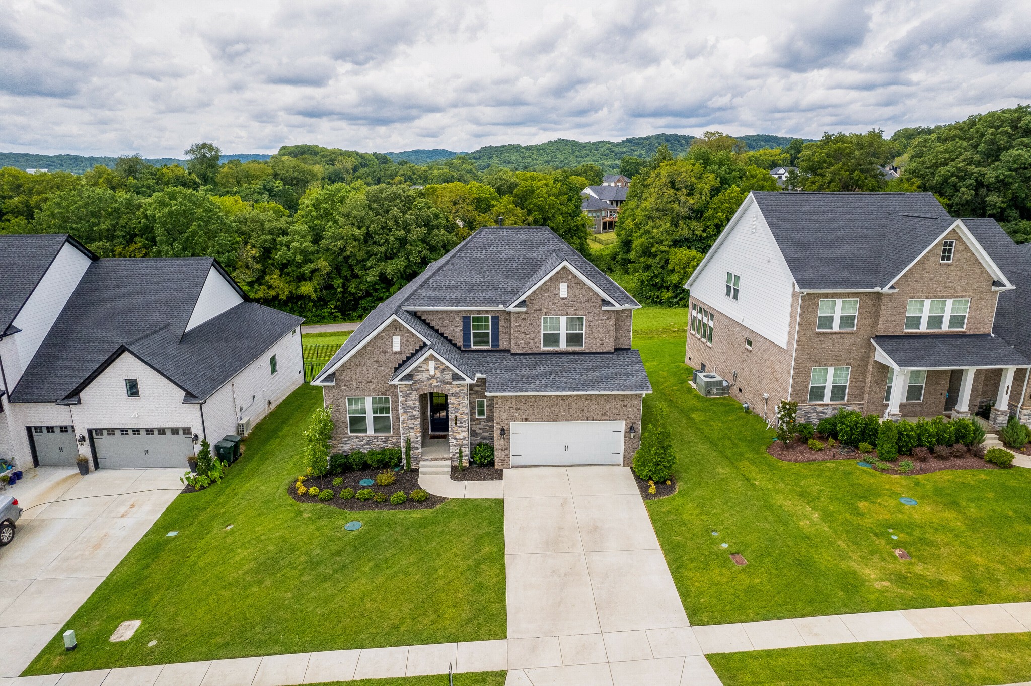 7751 Thayer Road Nolensville, TN 37135 - Photo 55 of 69 a view of house with garden and tall buildings