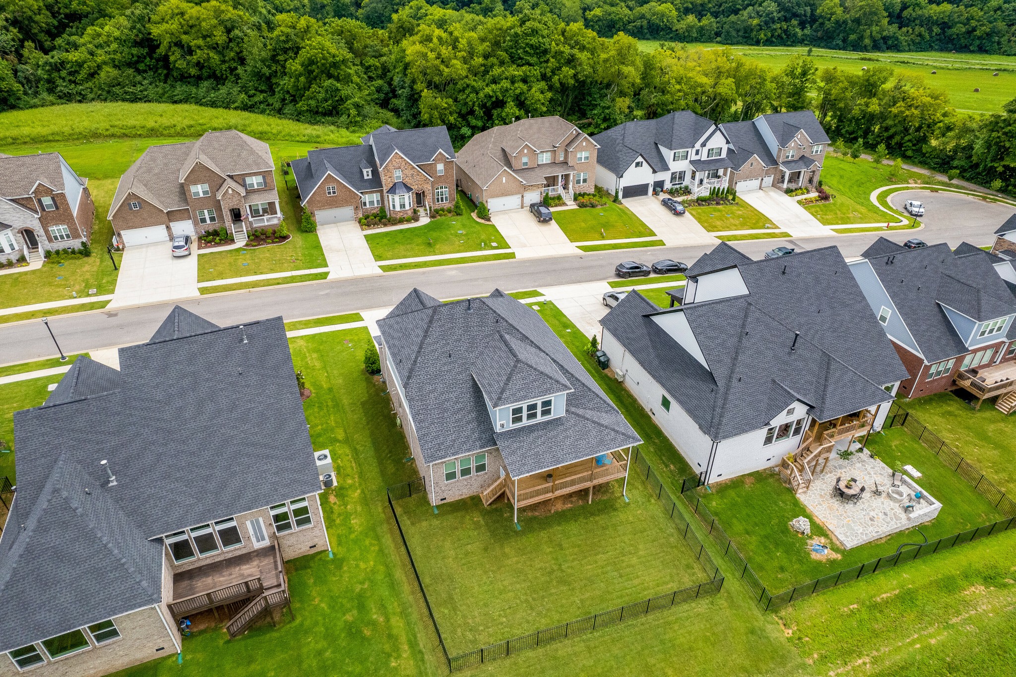 7751 Thayer Road Nolensville, TN 37135 - Photo 56 of 69 a view of a swimming pool with lawn chairs and a yard