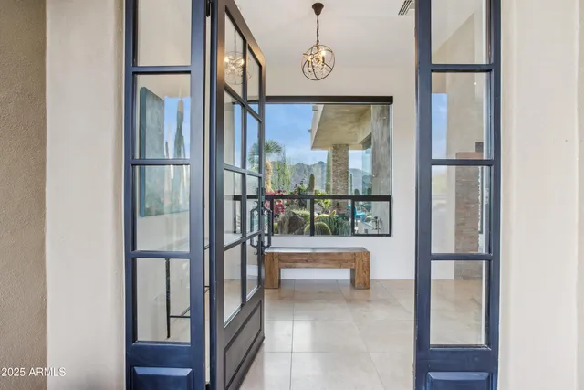 a view of a chairs and table in a patio