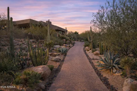 a view of a porch with chairs and a potted plant
