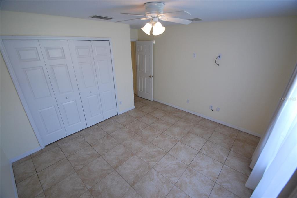 217 Robin Road Davenport, FL 33896 - Photo 17 of 27 a view of a chandelier fan