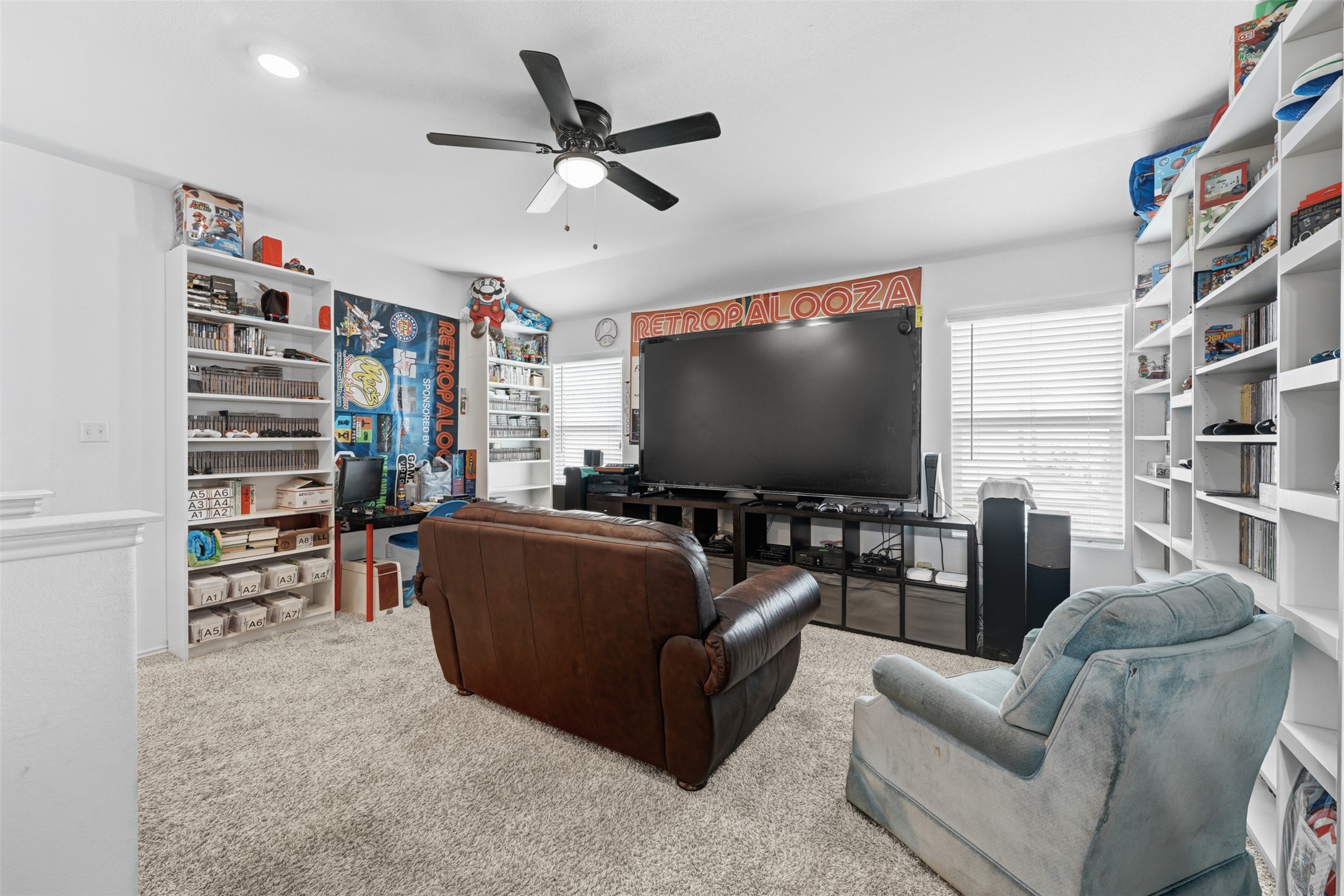 413 Perfect World Loop Jarrell, TX 76537 - Photo 25 of 39 A versatile bonus room or entertainment zone with practical shelving and comfortable seating.