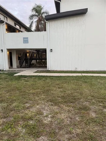 a view of a livingroom with an empty space and a fireplace