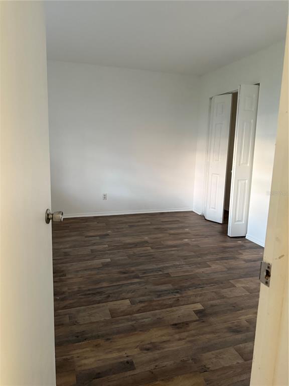 1264 East 113th Avenue, Unit J102 Tampa, FL 33612 - Photo 8 of 9 a view of wooden floor
