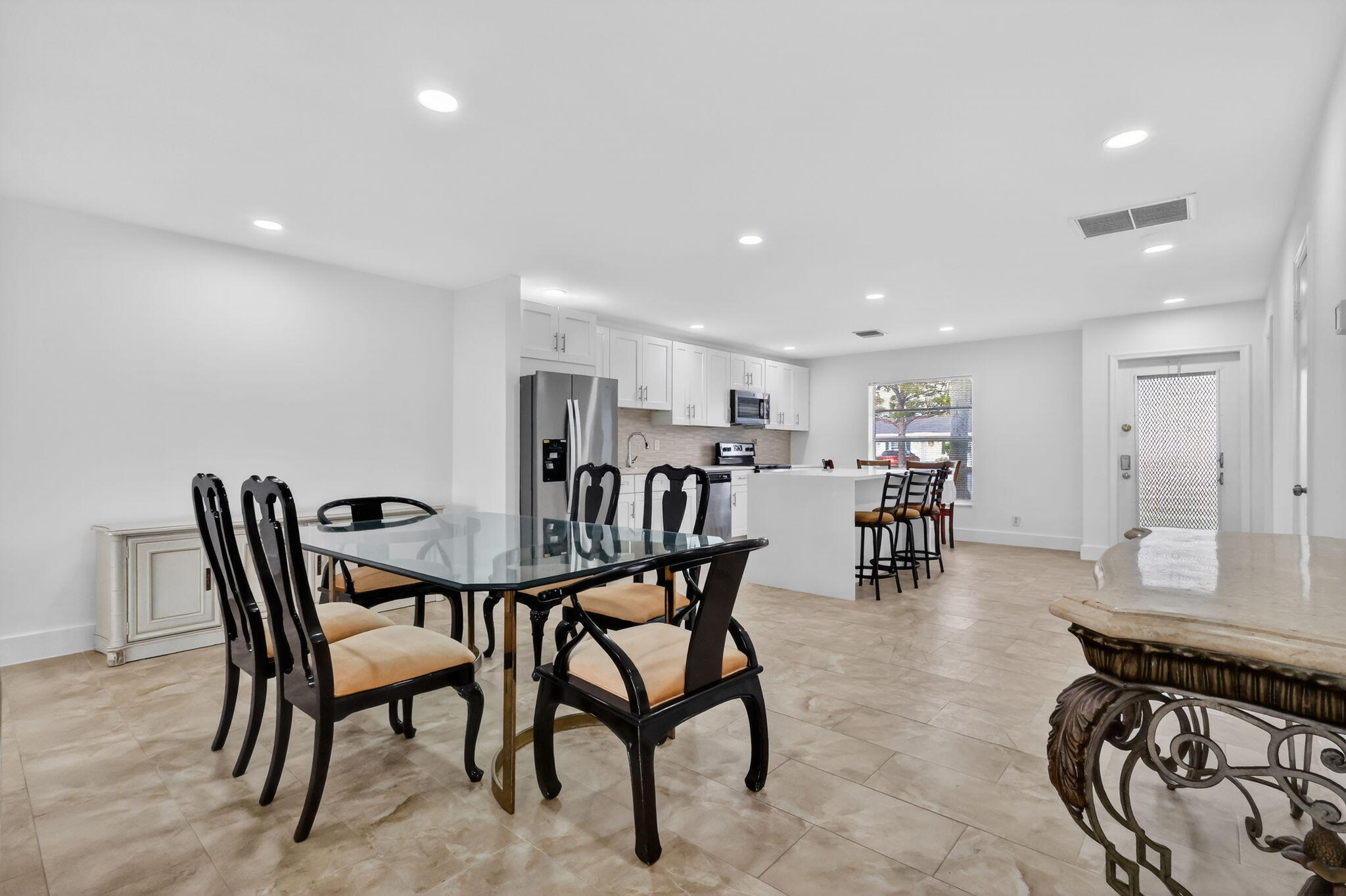 5093 Privet Place, Unit A1 Delray Beach, FL 33484 - Photo 14 of 54 a view of a a dining room with furniture and a table
