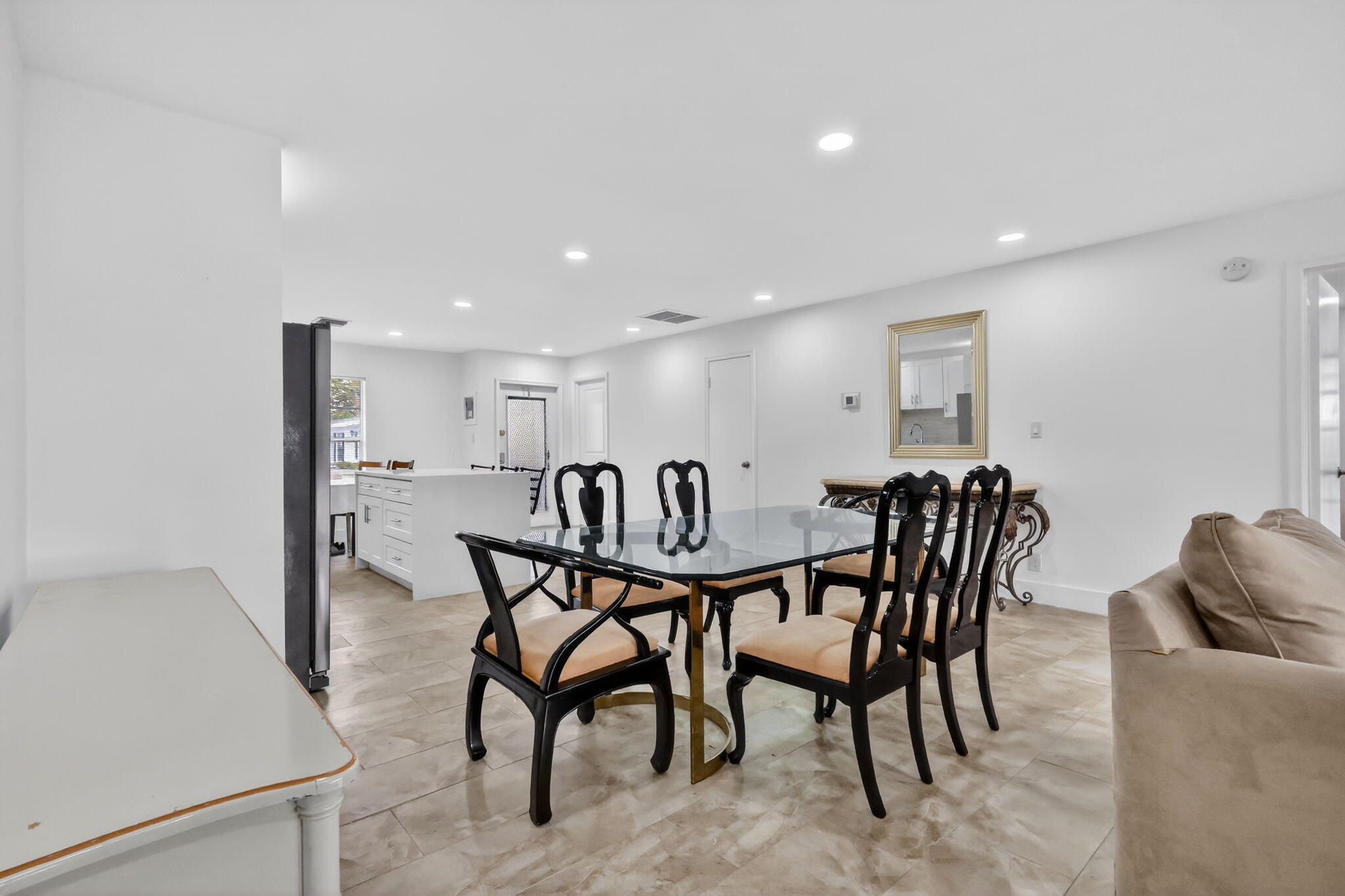 5093 Privet Place, Unit A1 Delray Beach, FL 33484 - Photo 15 of 54 a view of a dining room with furniture