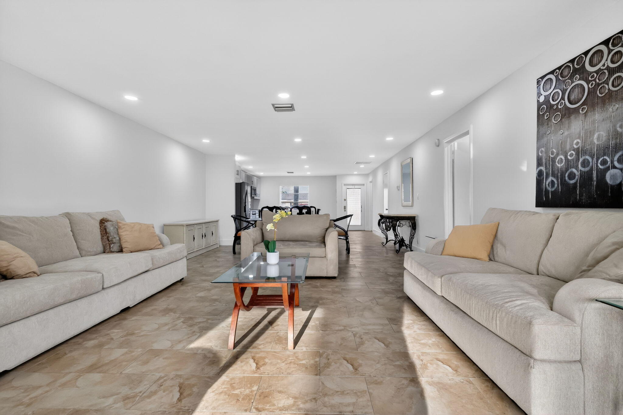 5093 Privet Place, Unit A1 Delray Beach, FL 33484 - Photo 21 of 54 a living room with furniture and wooden floor