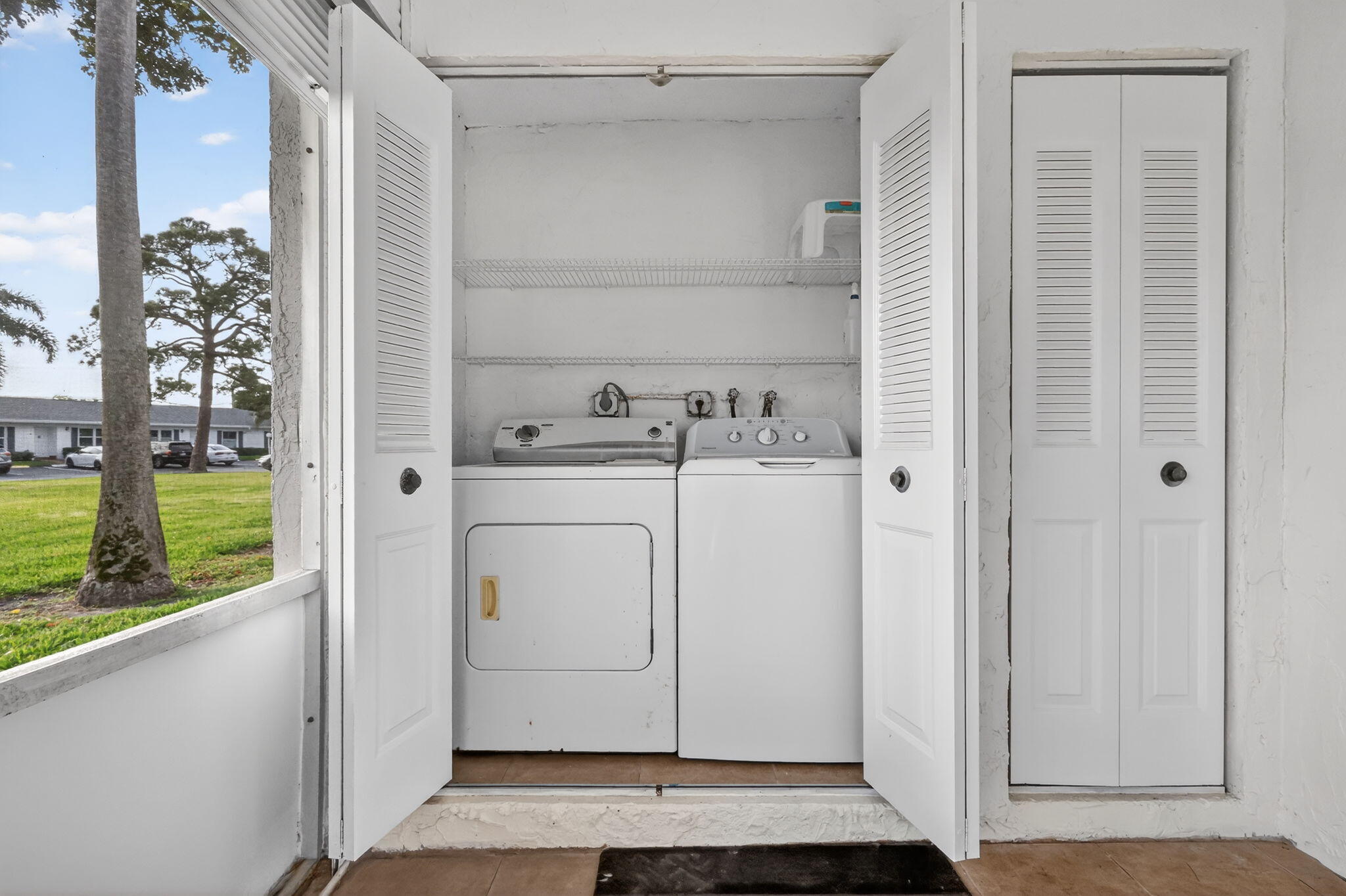 5093 Privet Place, Unit A1 Delray Beach, FL 33484 - Photo 24 of 54 a utility room with dryer and washer