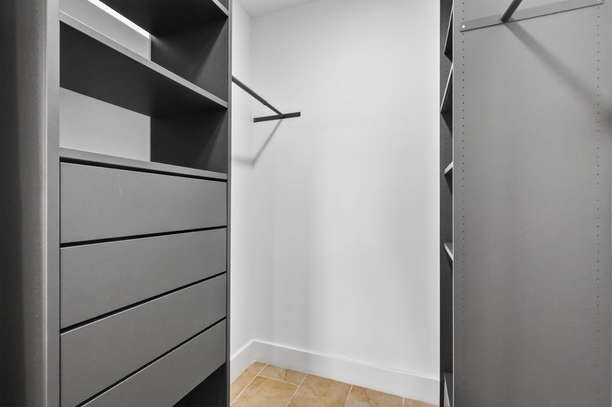 5093 Privet Place, Unit A1 Delray Beach, FL 33484 - Photo 31 of 54 a view of walk in closet with empty racks