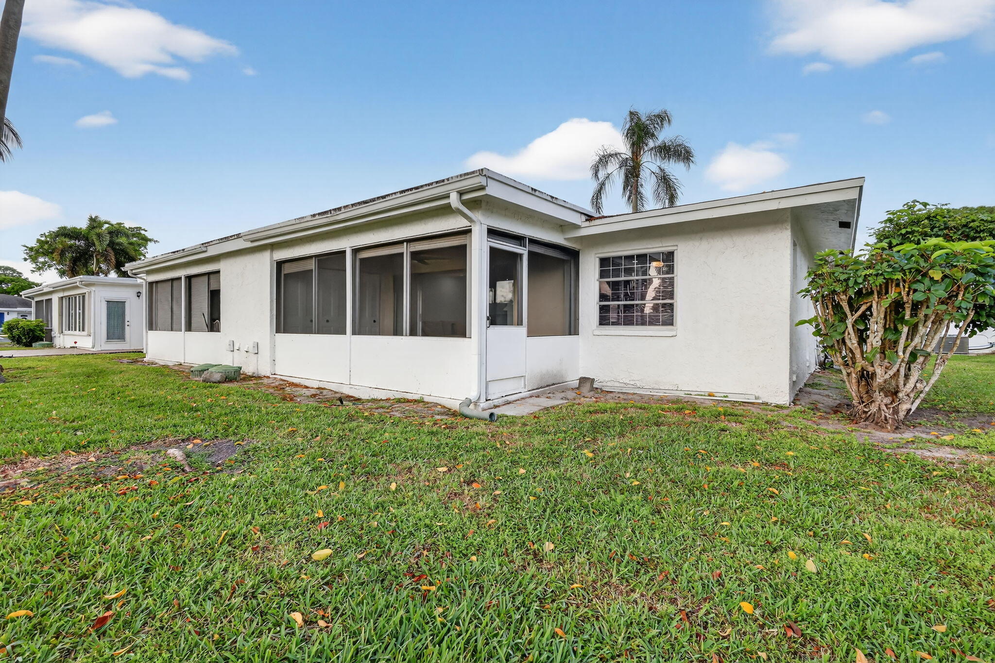 5093 Privet Place, Unit A1 Delray Beach, FL 33484 - Photo 38 of 54 a view of a house with yard