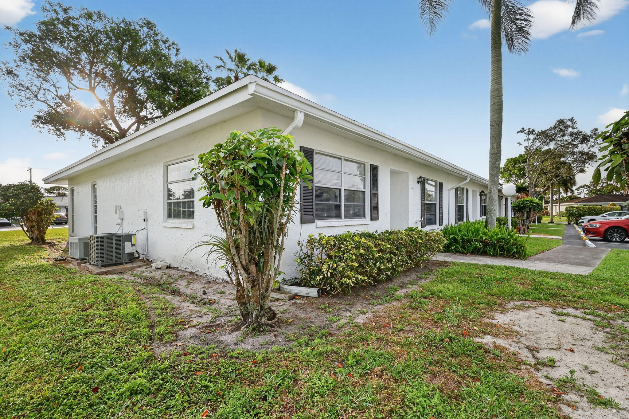 5093 Privet Place, Unit A1 Delray Beach, FL 33484 - Photo 40 of 54 a view of a house with a yard