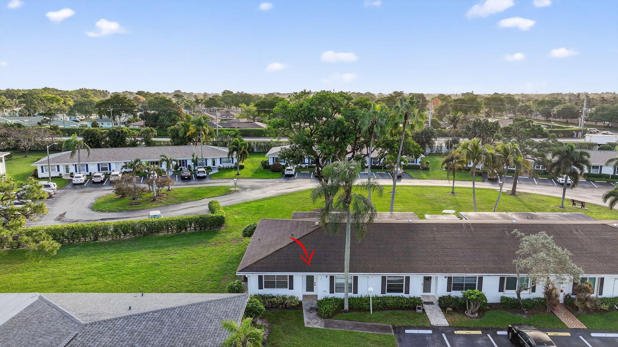 5093 Privet Place, Unit A1 Delray Beach, FL 33484 - Photo 41 of 54 an aerial view of a house with a garden and a yard