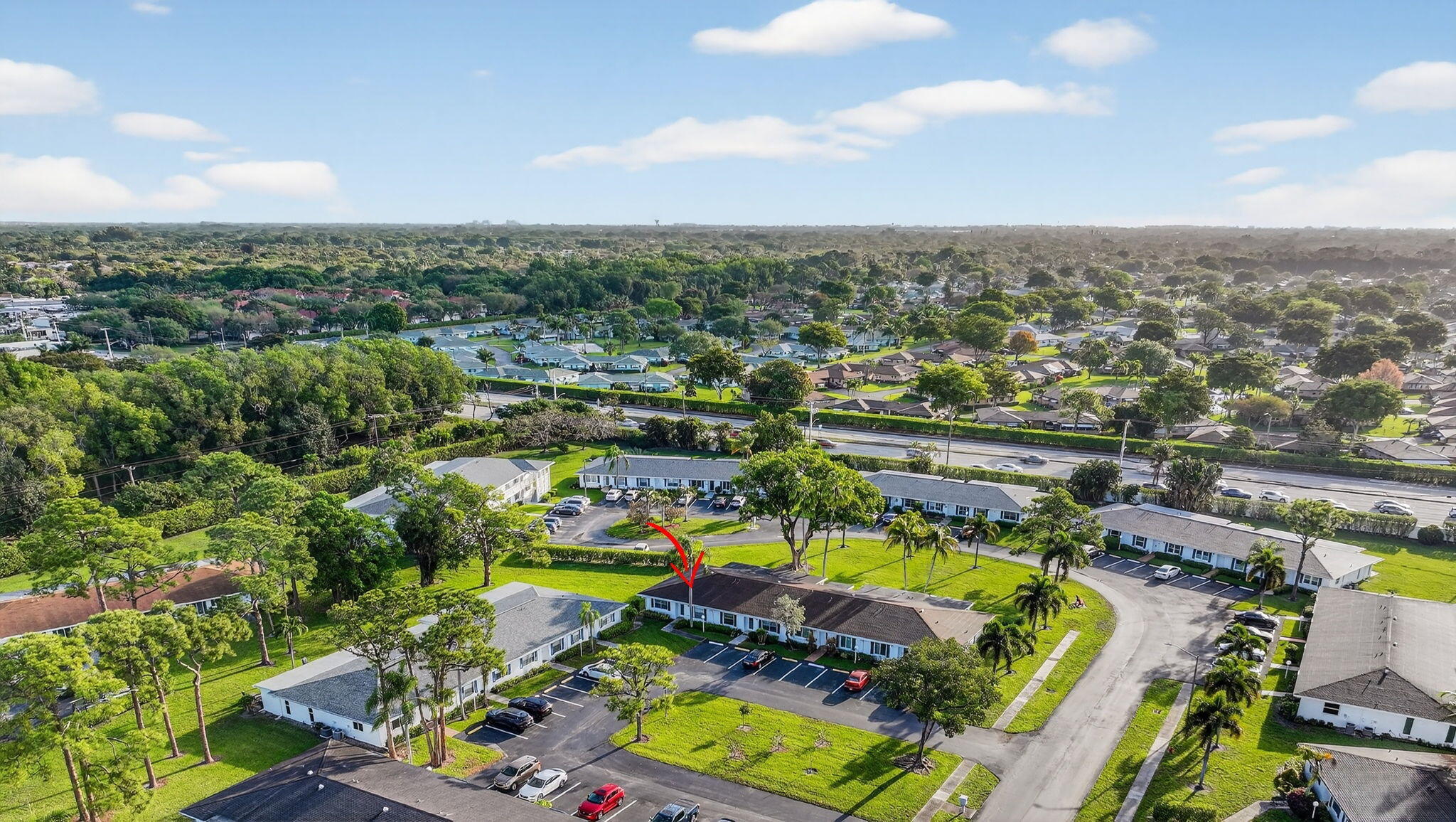 5093 Privet Place, Unit A1 Delray Beach, FL 33484 - Photo 44 of 54 an aerial view of a house with a swimming pool yard and outdoor seating