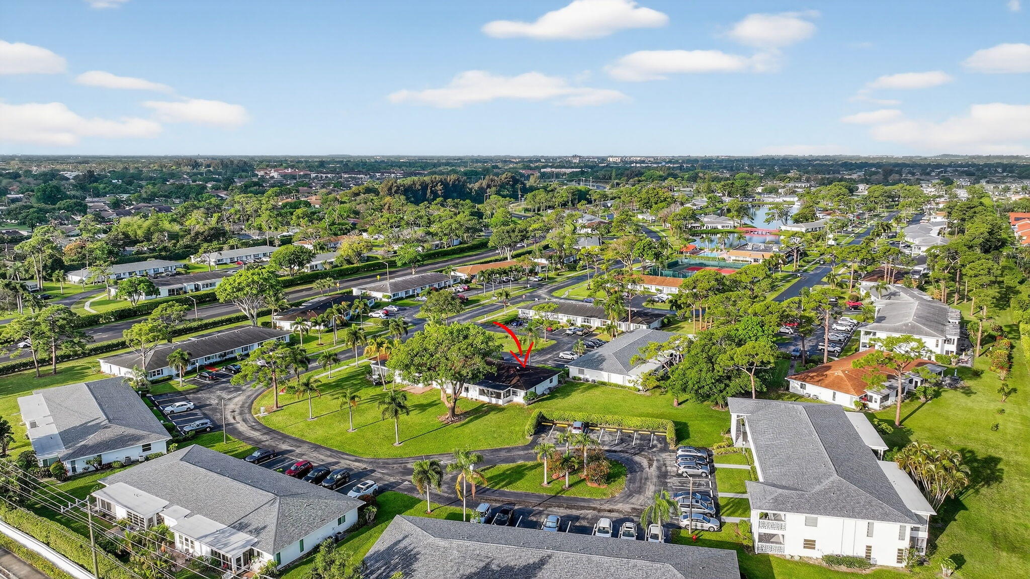 5093 Privet Place, Unit A1 Delray Beach, FL 33484 - Photo 46 of 54 an aerial view of residential houses with outdoor space and trees