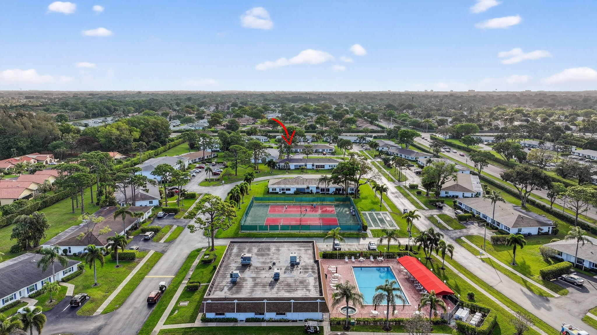 5093 Privet Place, Unit A1 Delray Beach, FL 33484 - Photo 50 of 54 an aerial view of multiple houses with yard