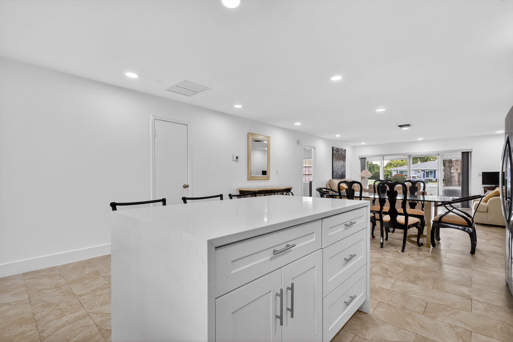 5093 Privet Place, Unit A1 Delray Beach, FL 33484 - Photo 10 of 54 a view of a kitchen and dining room