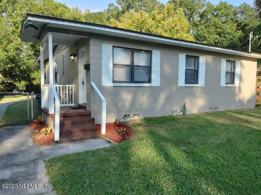 5721 Bree Road Jacksonville, FL 32209 - Photo 1 of 15 a front view of a house with garden
