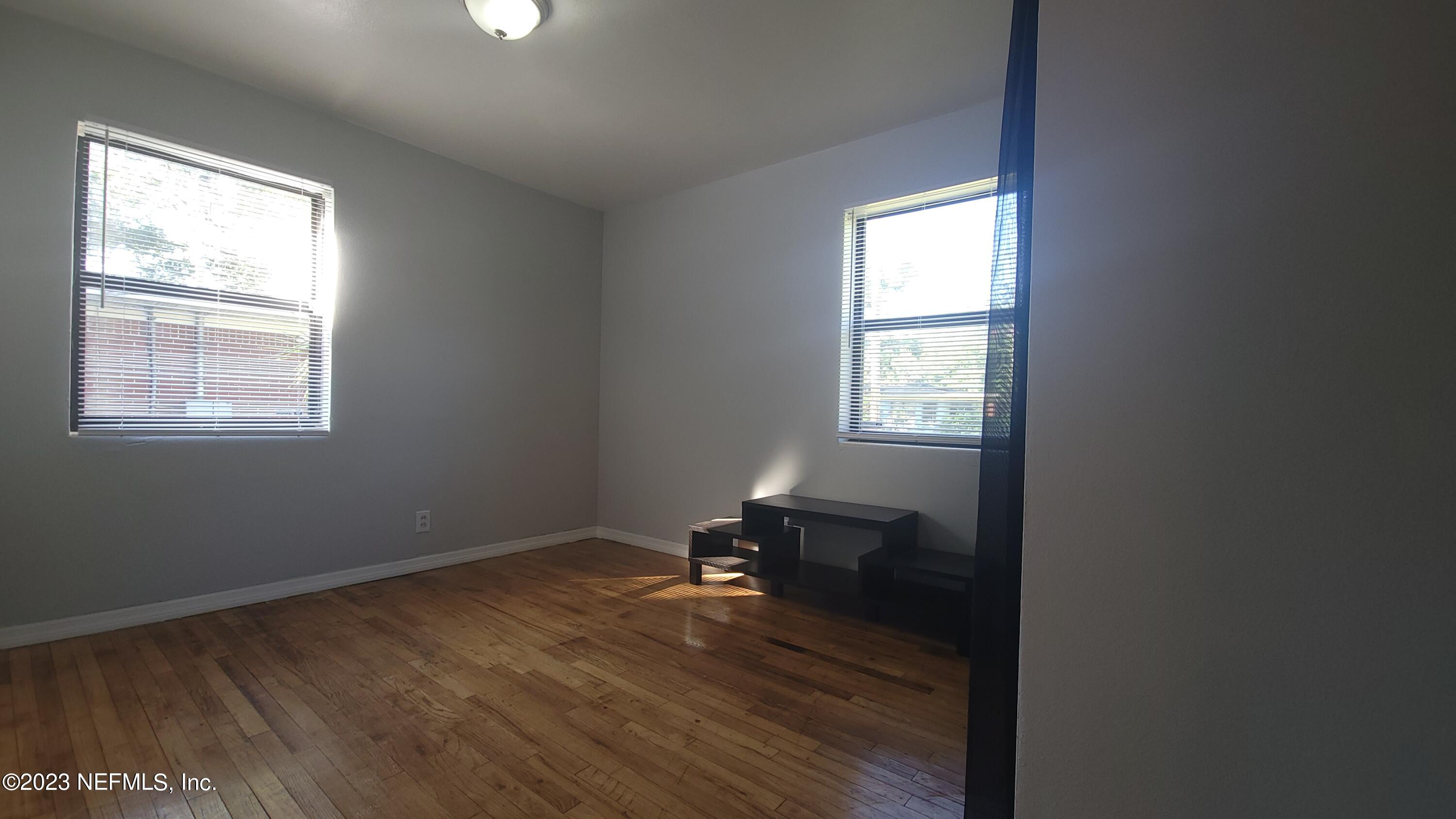 5721 Bree Road Jacksonville, FL 32209 - Photo 12 of 15 a room with a window and a wooden floor