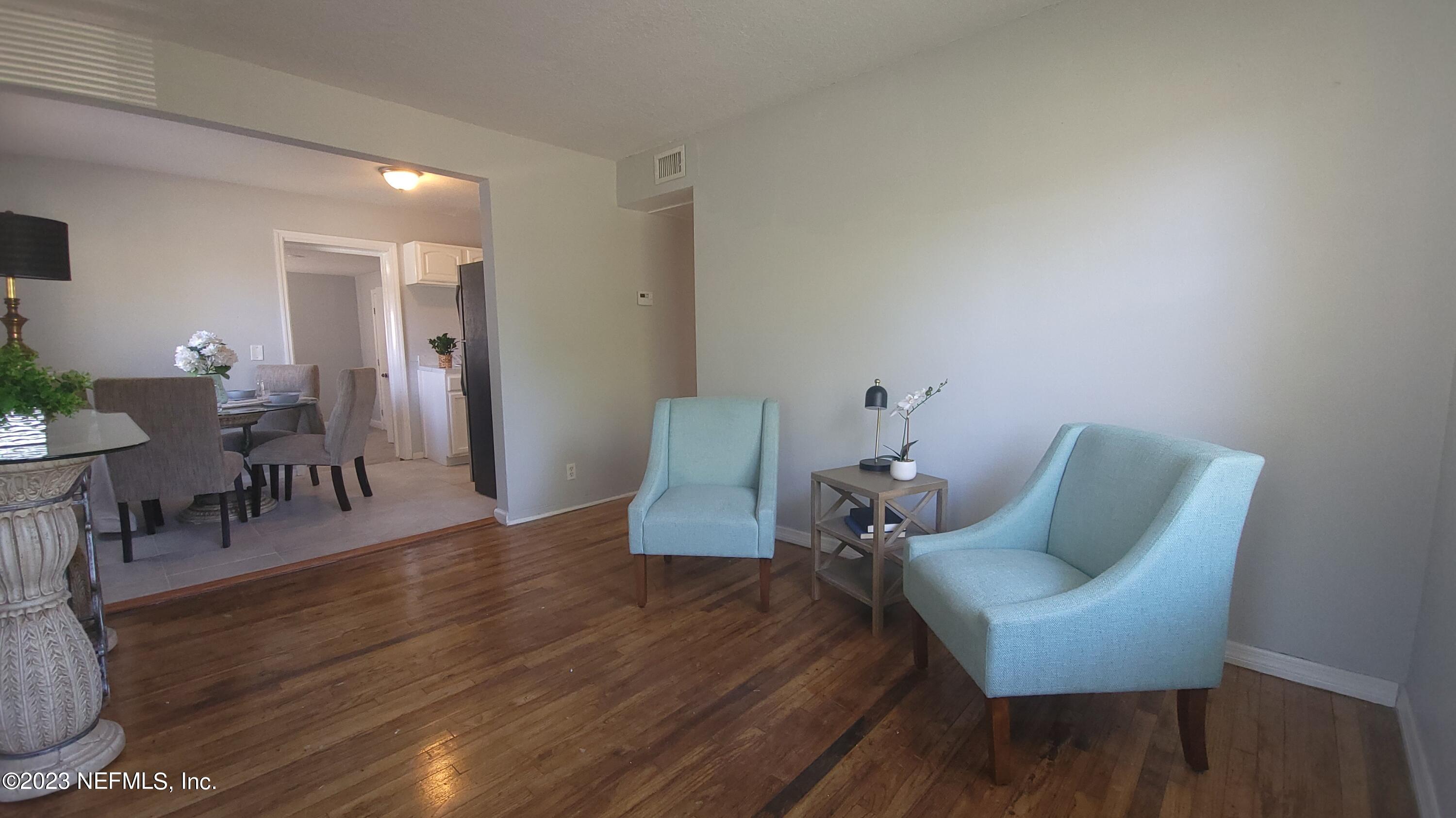 5721 Bree Road Jacksonville, FL 32209 - Photo 3 of 15 a living room with furniture and a wooden floor