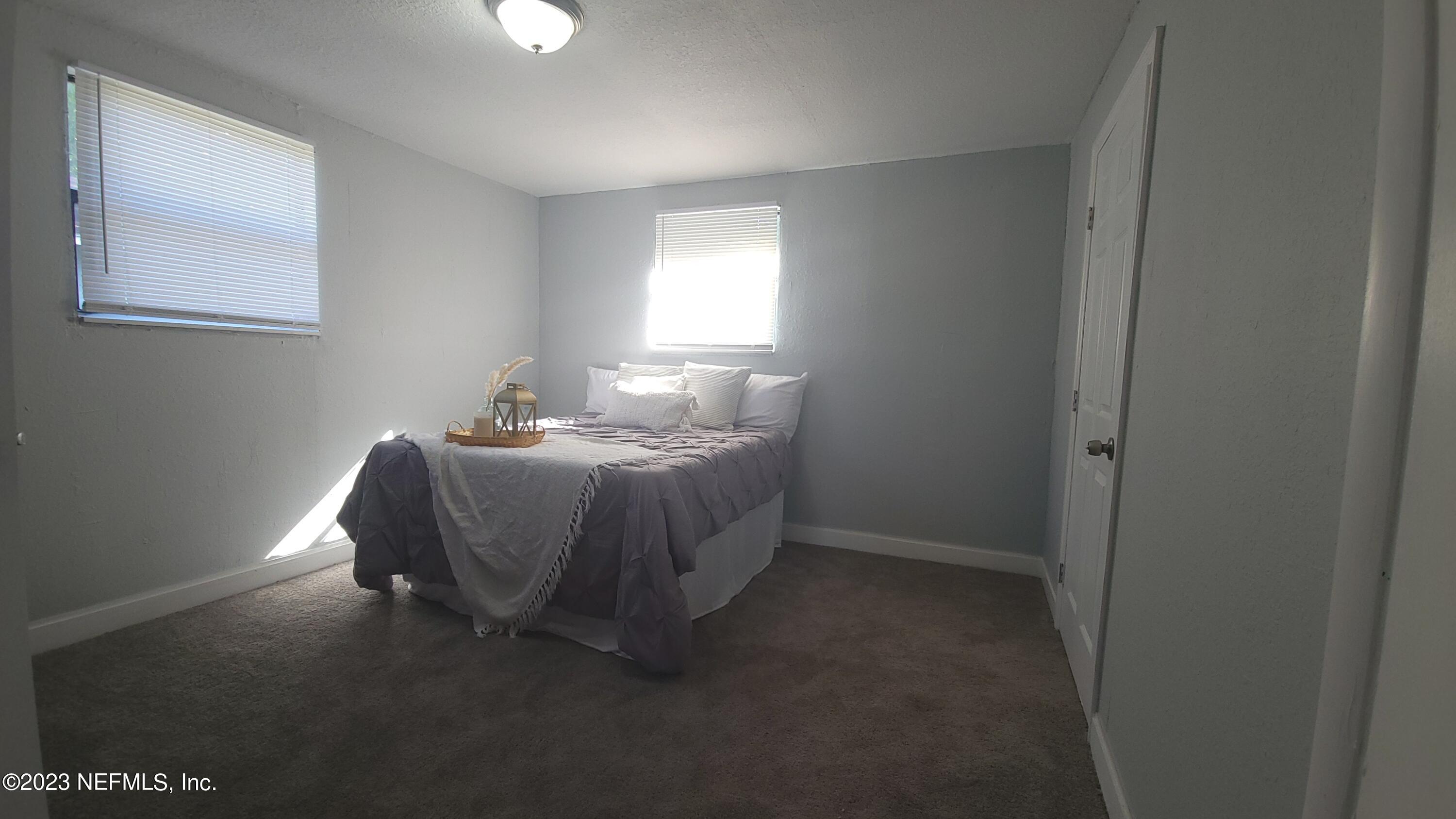 5721 Bree Road Jacksonville, FL 32209 - Photo 8 of 15 a room with a bed and a window