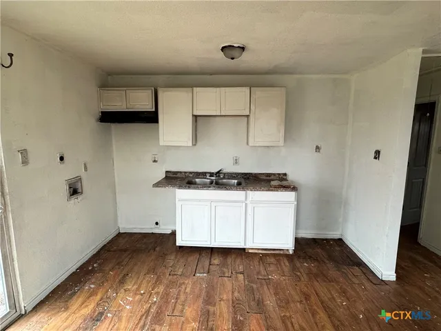 a view of a room that has a large window