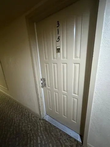 a view of room with window and wooden floor