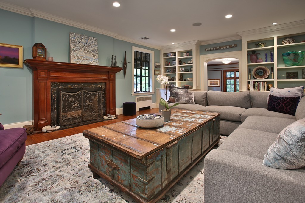 11 Worthington Road Brookline, MA 02446 - Photo 3 of 21 a living room with furniture a fireplace and a large window