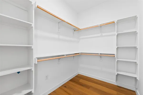 a view of an empty walk in closet