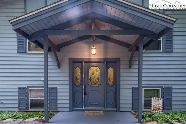 a front view of a house with shower and garden