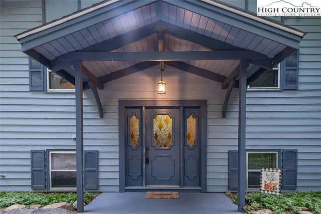 a front view of a house with shower and garden