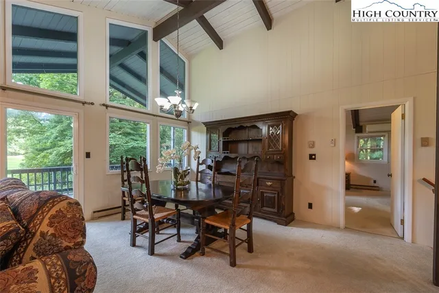 a view of a livingroom with furniture and windows