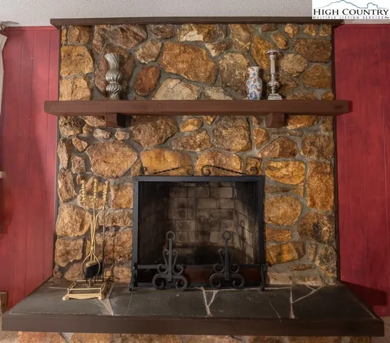 a room with a fireplace and a window