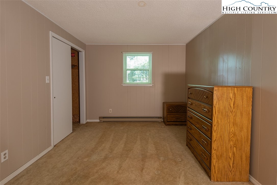 377 Deer Run Road Glade Valley, NC 28627 - Photo 23 of 26 a view of an empty room with a window
