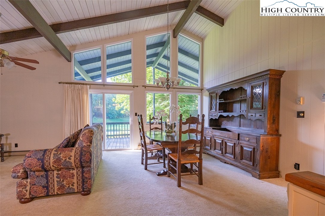 377 Deer Run Road Glade Valley, NC 28627 - Photo 6 of 26 a living room with furniture and a flat screen tv