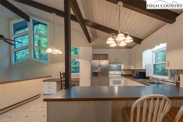 a kitchen with counter top space cabinets and stainless steel appliances