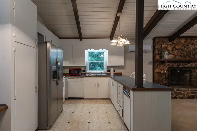 a kitchen with a sink and refrigerator