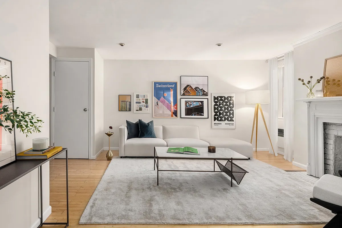 162 9th Avenue, Unit B Manhattan, NY 10035 - Photo 2 of 9 a living room with furniture and a rug