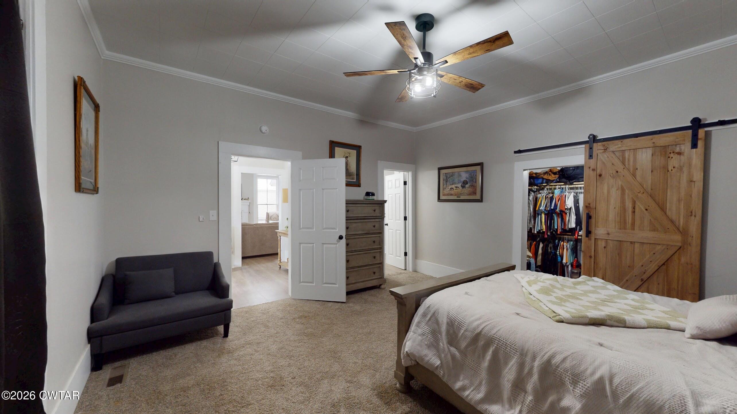 2800 Locust Grove Road Newbern, TN 38059 - Photo 28 of 46 a bedroom with a bed and a walk in closet