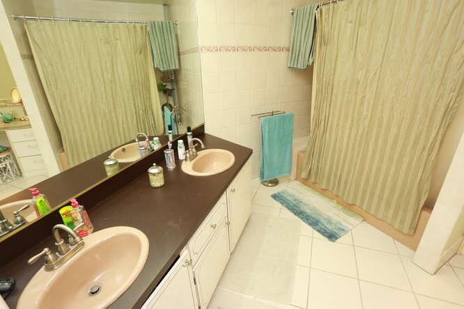 5605 2nd Road Lake Worth, FL 33467 - Photo 13 of 30 a bathroom with a granite countertop sink and a mirror